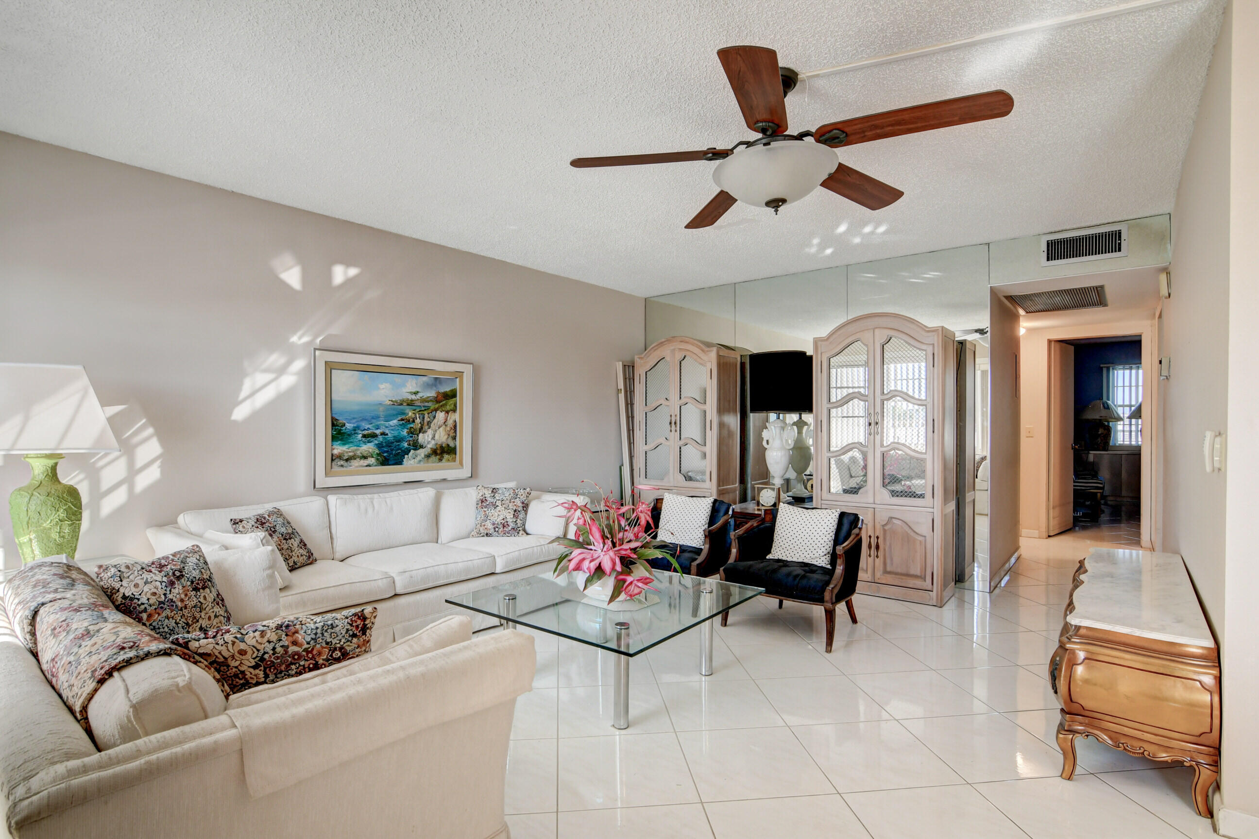 4044 Exeter C Boca Raton, FL 33434 - Photo 9 of 69 a living room with furniture and a chandelier