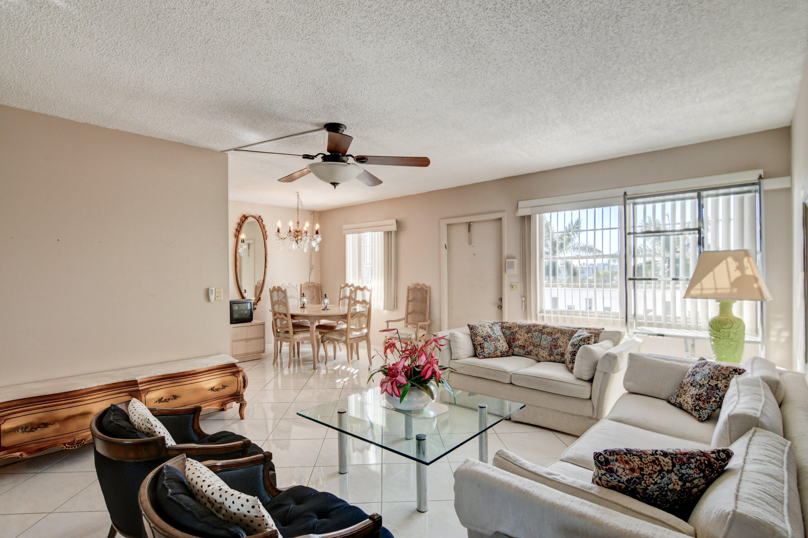 4044 Exeter C Boca Raton, FL 33434 - Photo 10 of 69 a living room with furniture and a large window