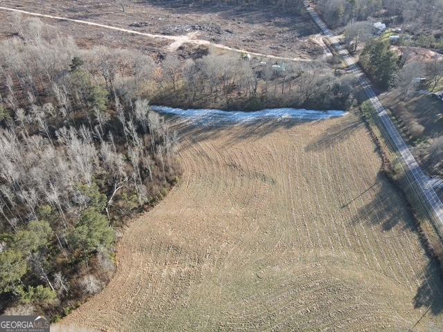 Lot 4 Kendrick Zebulon, GA 30295 - Photo 7 of 8 a view of a dry yard with wooden fence