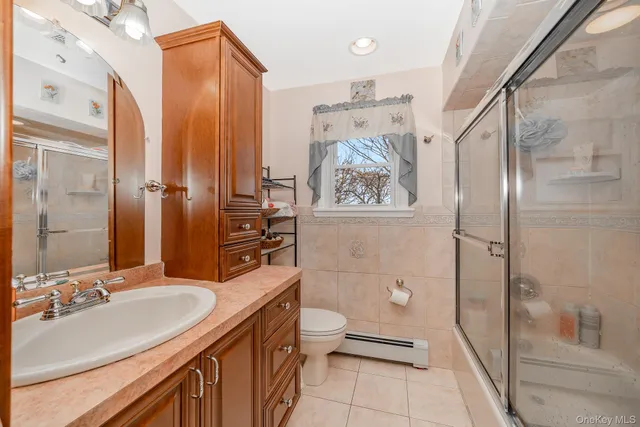 a bedroom with a bed and flat screen tv