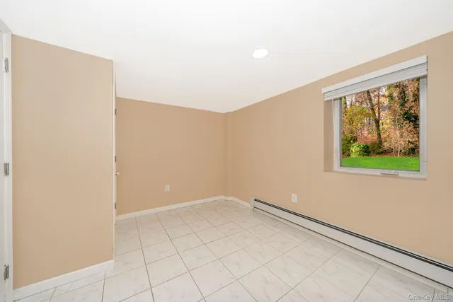 a bathroom with a toilet sink and a mirror