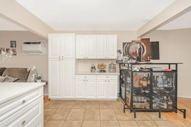 a kitchen with cabinets and window