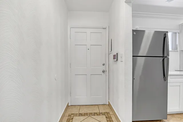 a bedroom with a large bed and a large window