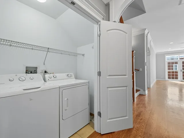 a utility room with closet dryer and washer