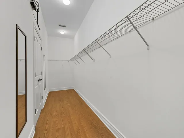 a view of a hallway with staircase