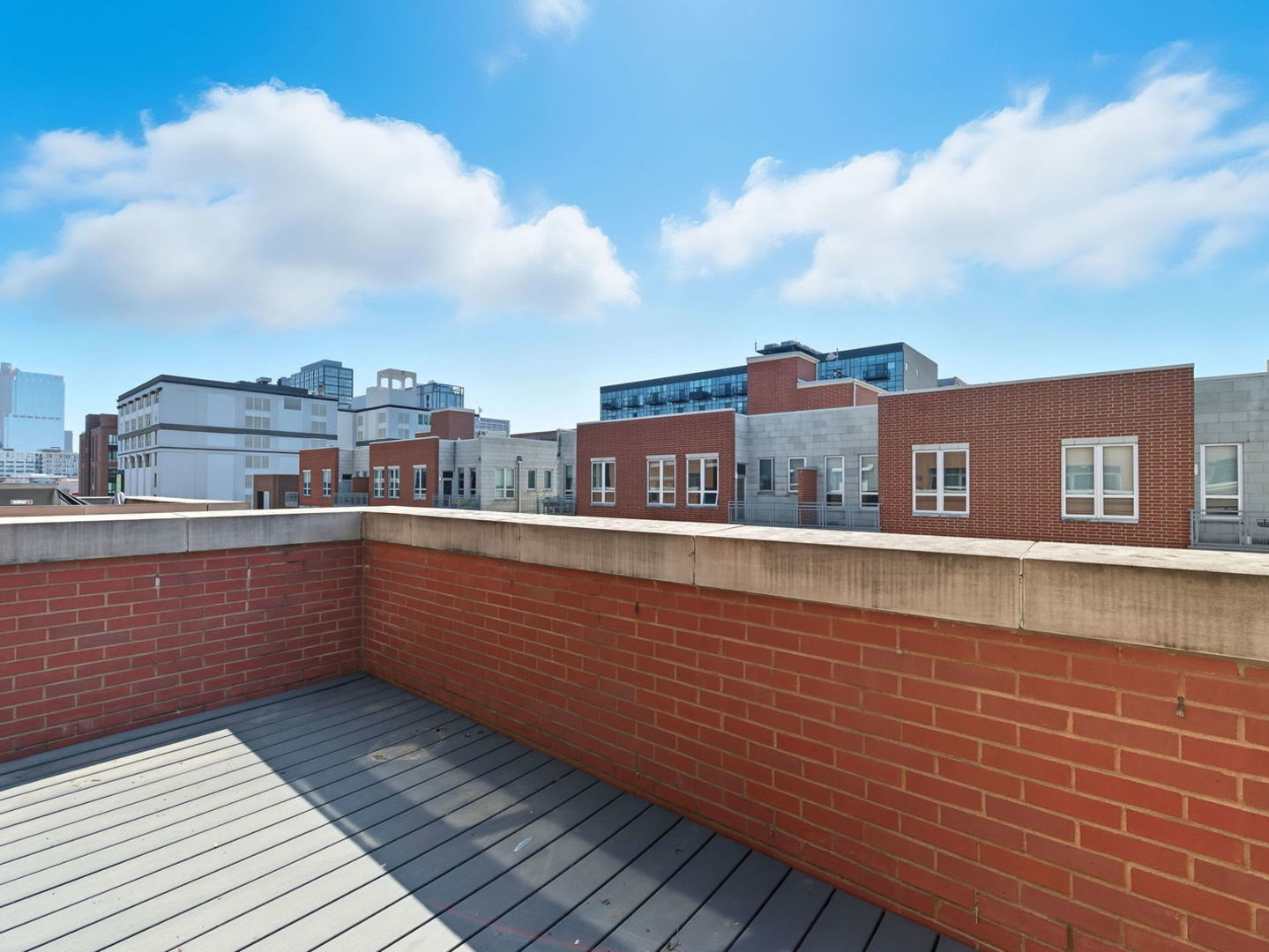 1248 West Jackson Boulevard, Unit 4W Chicago, IL 60607 - Photo 10 of 24 a view of city from a balcony