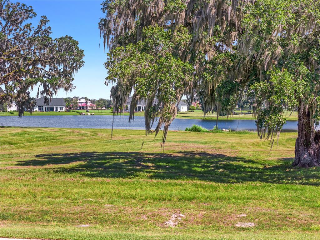27 Southwest 138th Loop Dunnellon, FL 34432 - Photo 11 of 27 a view of a swimming pool with an outdoor space and seating area