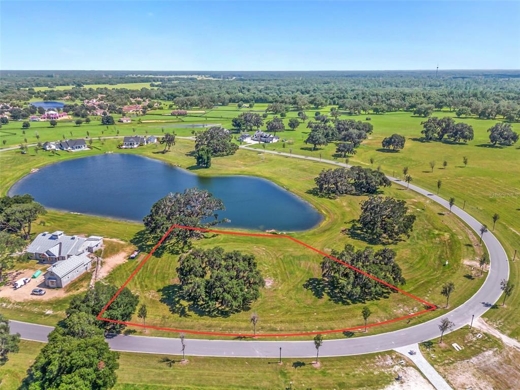 27 Southwest 138th Loop Dunnellon, FL 34432 - Photo 3 of 27 an aerial view of a swimming pool with a yard