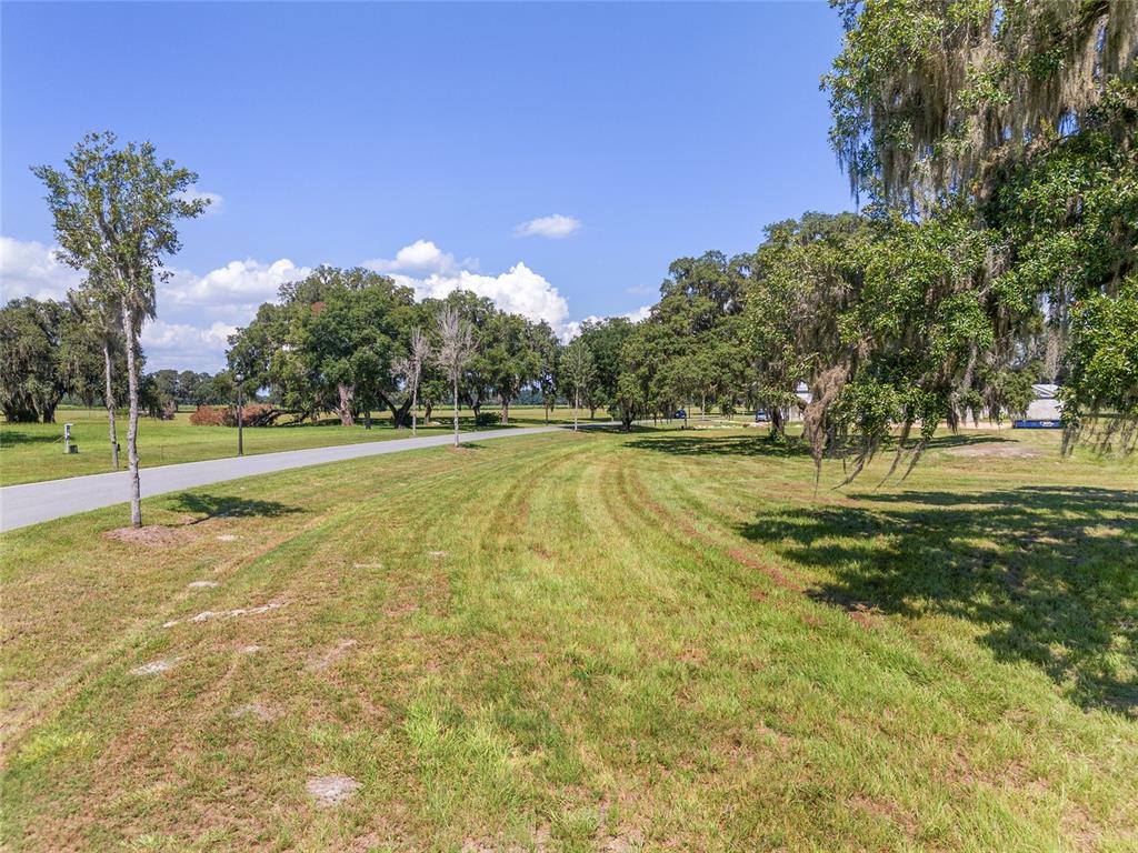 27 Southwest 138th Loop Dunnellon, FL 34432 - Photo 9 of 27 a view of a playground with basketball court