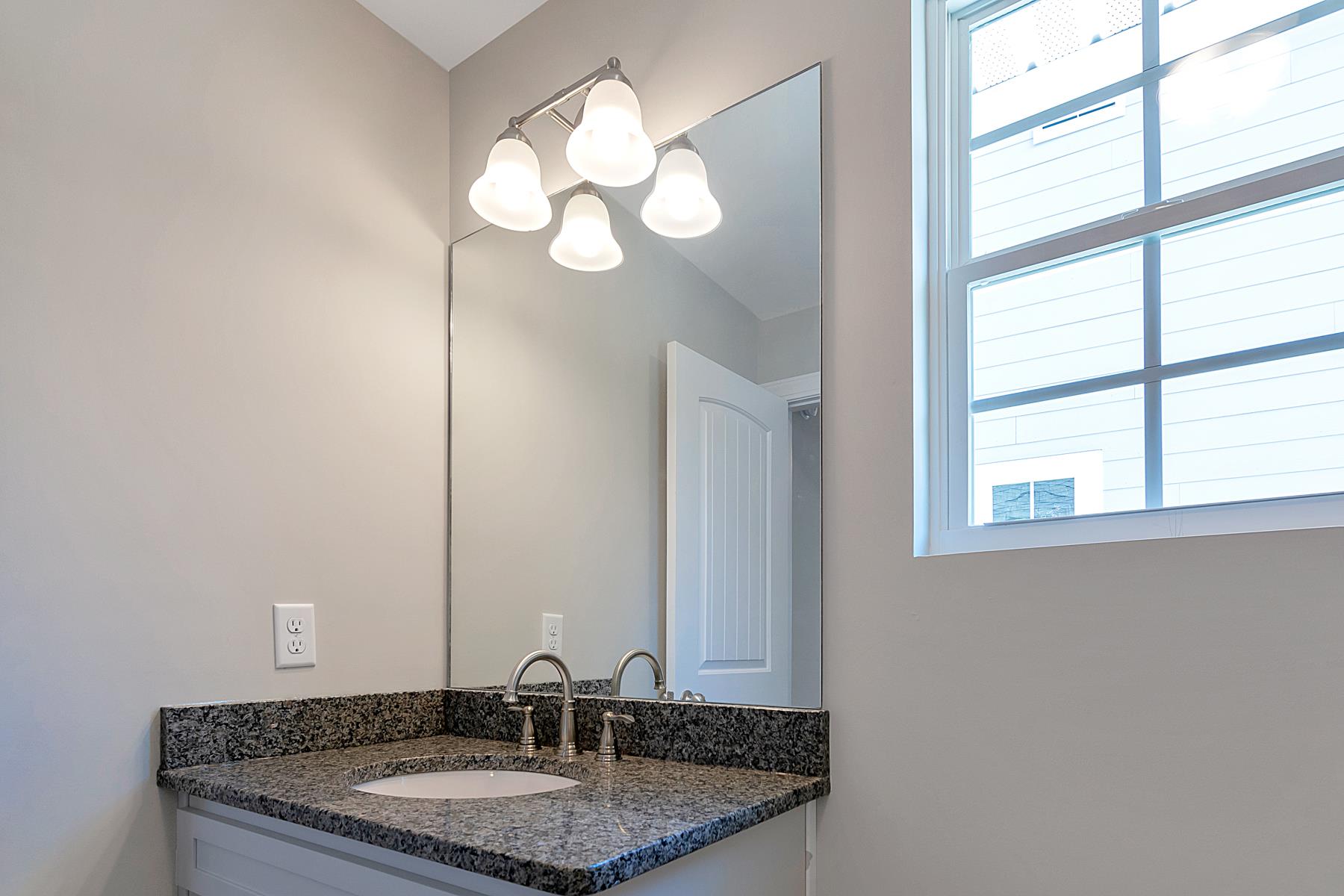 3547 Anderson Road Nashville, TN 37013 - Photo 11 of 11 All bathrooms feature beautiful fixtures, durable granite countertops, and wood-look tile.