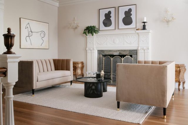 a living room with furniture and a fireplace