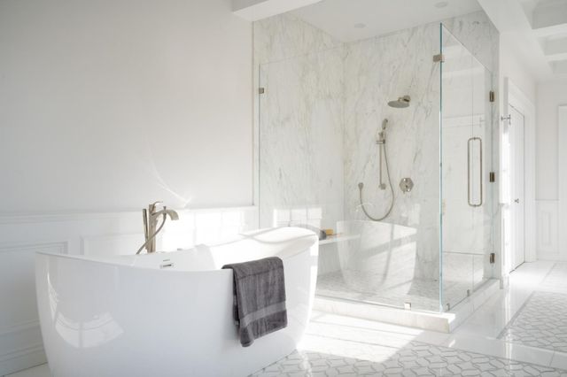 a bathroom with a bathtub and a shower