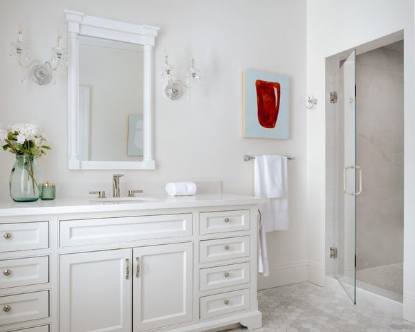 a bathroom with a sink vanity and mirror
