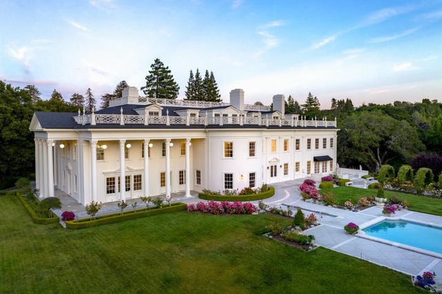 a large building with trees in front of it