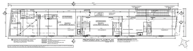 a black and white photo of a living room