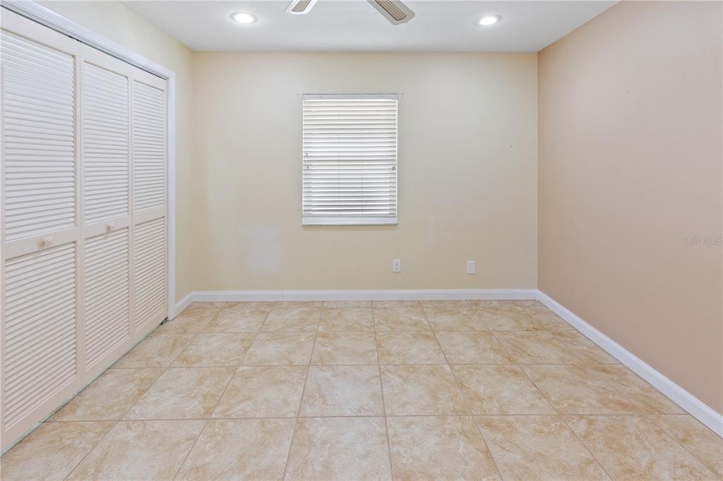 731 Canberra Road Winter Haven, FL 33884 - Photo 23 of 51 an empty room with windows