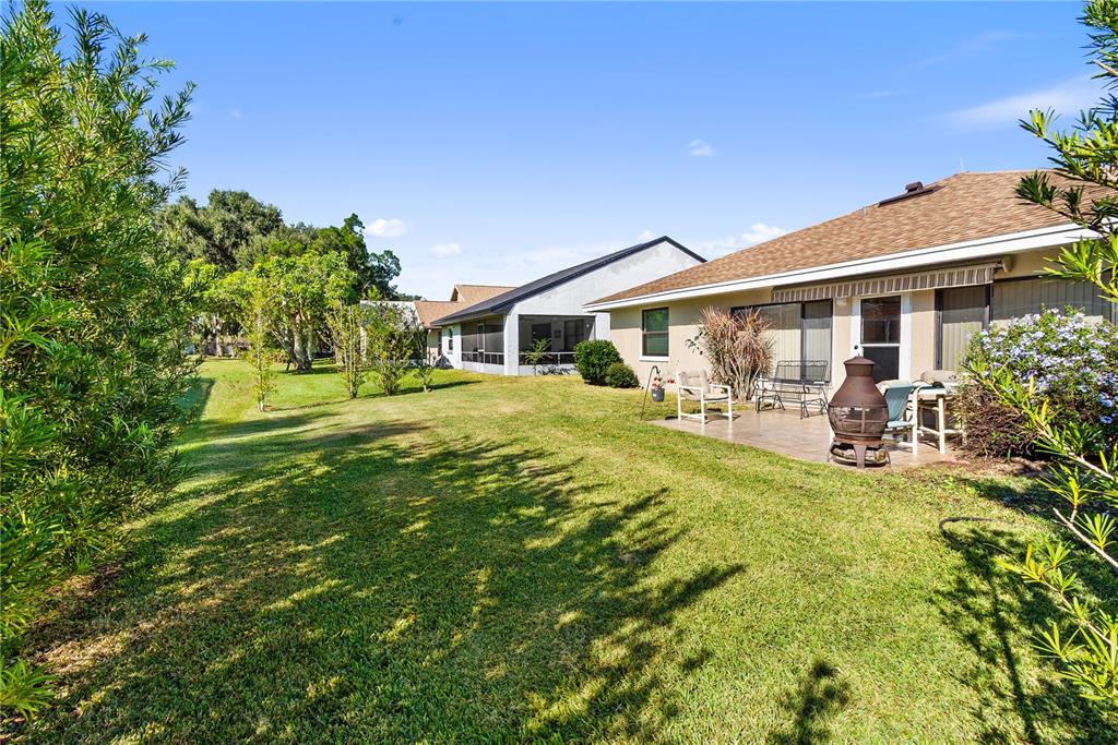 731 Canberra Road Winter Haven, FL 33884 - Photo 27 of 51 a view of a house with a yard patio and a patio