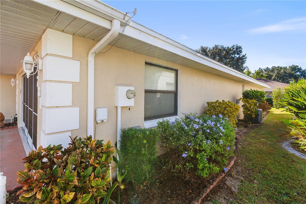 731 Canberra Road Winter Haven, FL 33884 - Photo 30 of 51 a backyard of a house with lots of green space