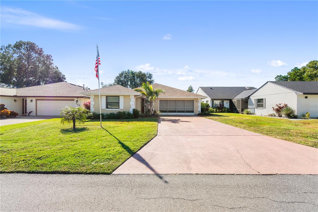 731 Canberra Road Winter Haven, FL 33884 - Photo 33 of 51 a view of house with swimming pool outdoor seating