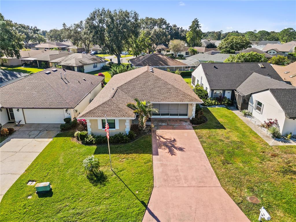731 Canberra Road Winter Haven, FL 33884 - Photo 34 of 51 an aerial view of a house with a yard
