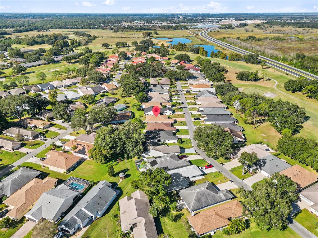 731 Canberra Road Winter Haven, FL 33884 - Photo 45 of 51 an aerial view of residential houses with outdoor space