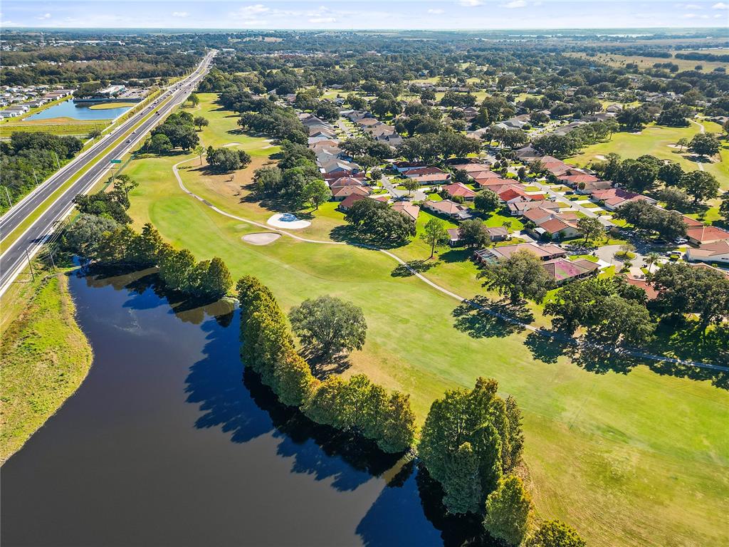 731 Canberra Road Winter Haven, FL 33884 - Photo 49 of 51 an aerial view of residential houses with outdoor space