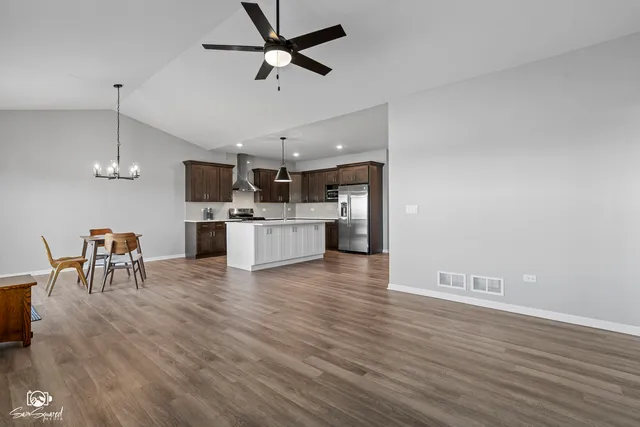 a view of kitchen with sink and microwave