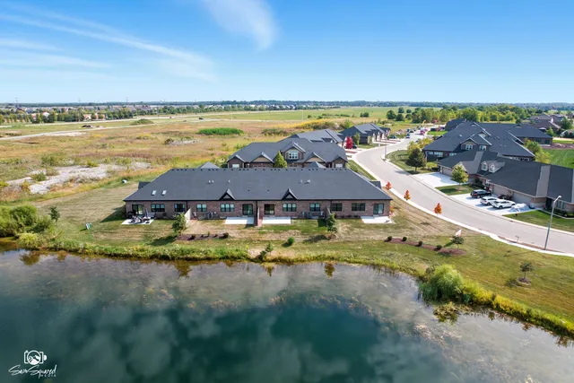 a aerial view of a house with a lake view