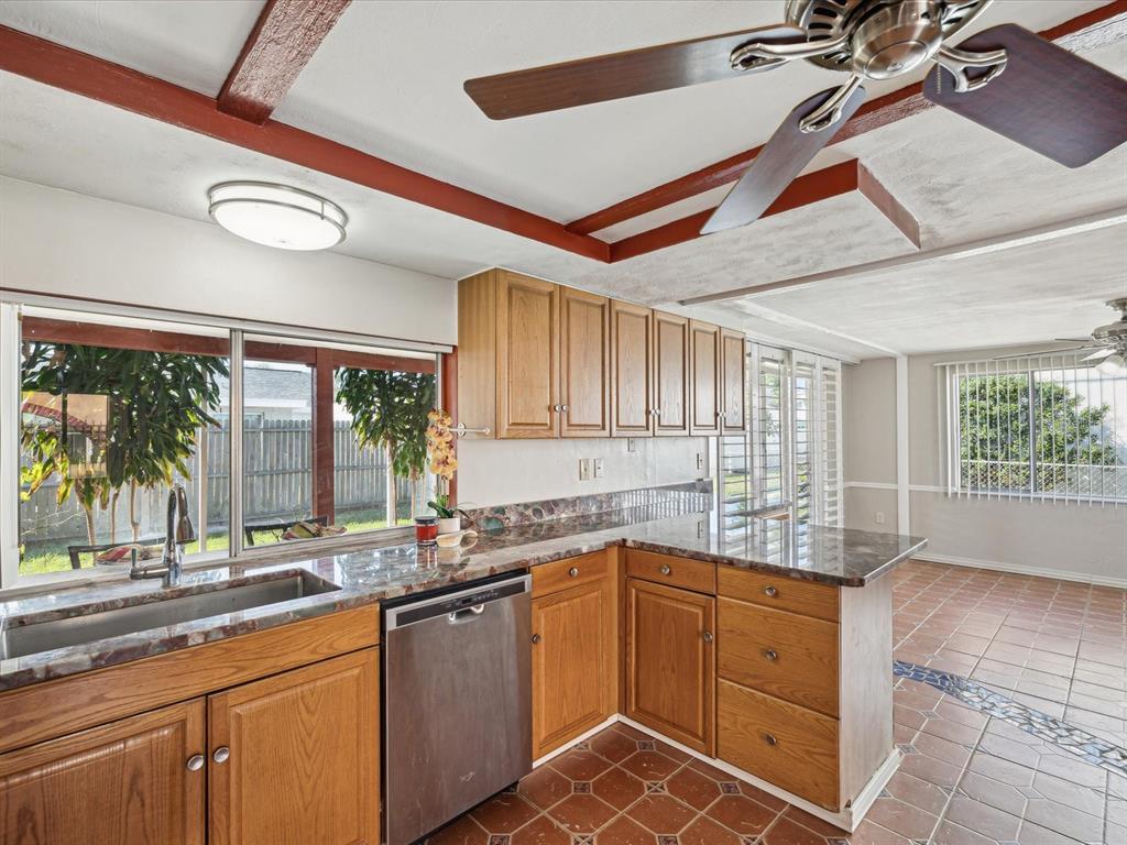 3730 Sail Drive New Port Richey, FL 34652 - Photo 11 of 50 a kitchen with a sink window and cabinets