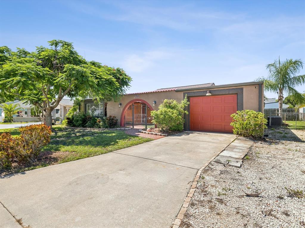3730 Sail Drive New Port Richey, FL 34652 - Photo 2 of 50 a front view of a house with garden