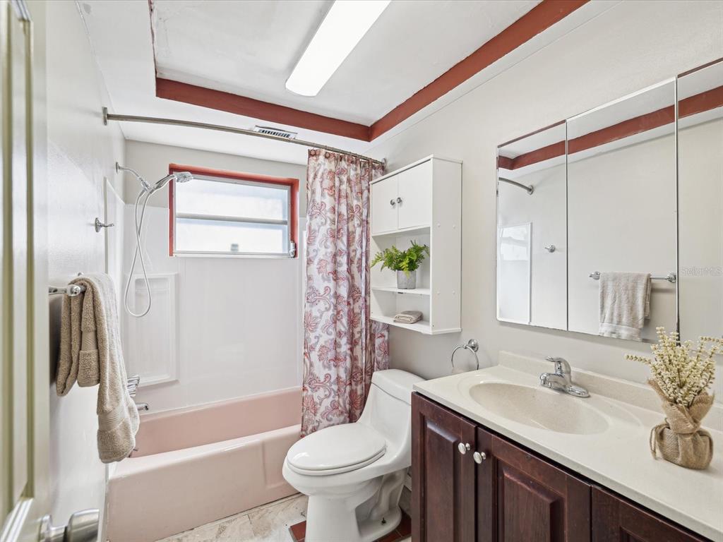 3730 Sail Drive New Port Richey, FL 34652 - Photo 23 of 50 a bathroom with a sink a toilet and shower