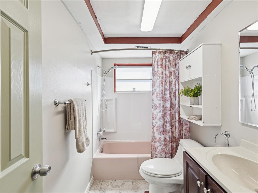 3730 Sail Drive New Port Richey, FL 34652 - Photo 24 of 50 a bathroom with a sink toilet and shower