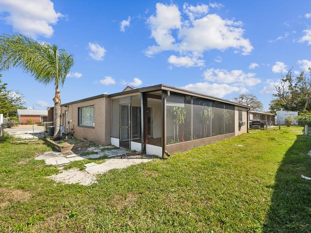 3730 Sail Drive New Port Richey, FL 34652 - Photo 37 of 50 a view of a backyard of the house