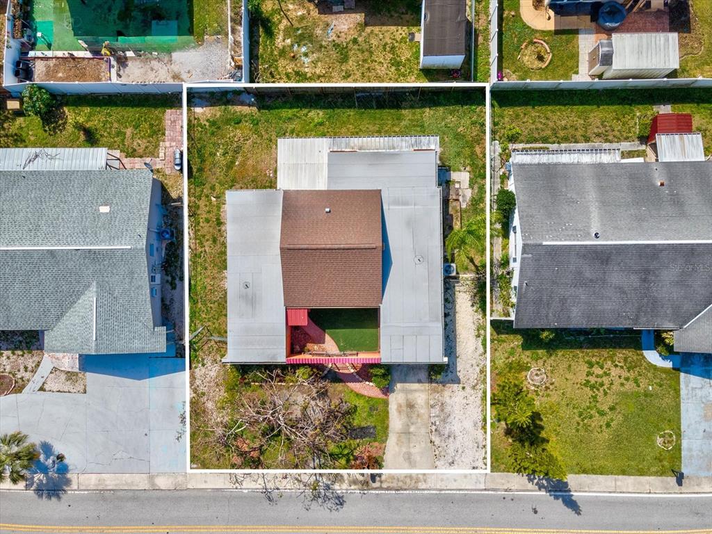 3730 Sail Drive New Port Richey, FL 34652 - Photo 42 of 50 an aerial view of a house with a yard and a fountain