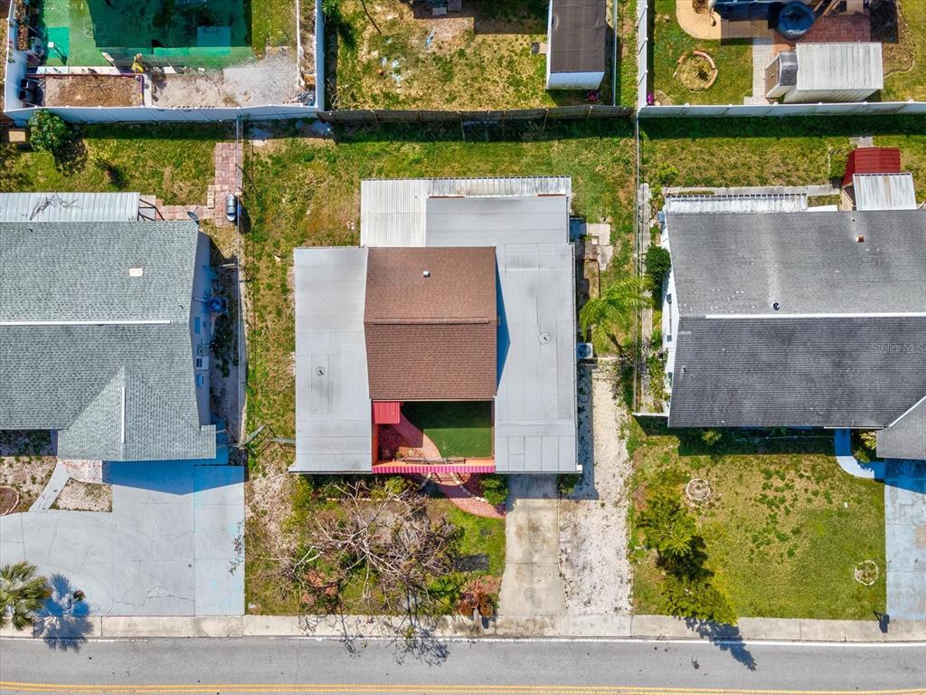 3730 Sail Drive New Port Richey, FL 34652 - Photo 43 of 50 an aerial view of a house with a yard and a fountain