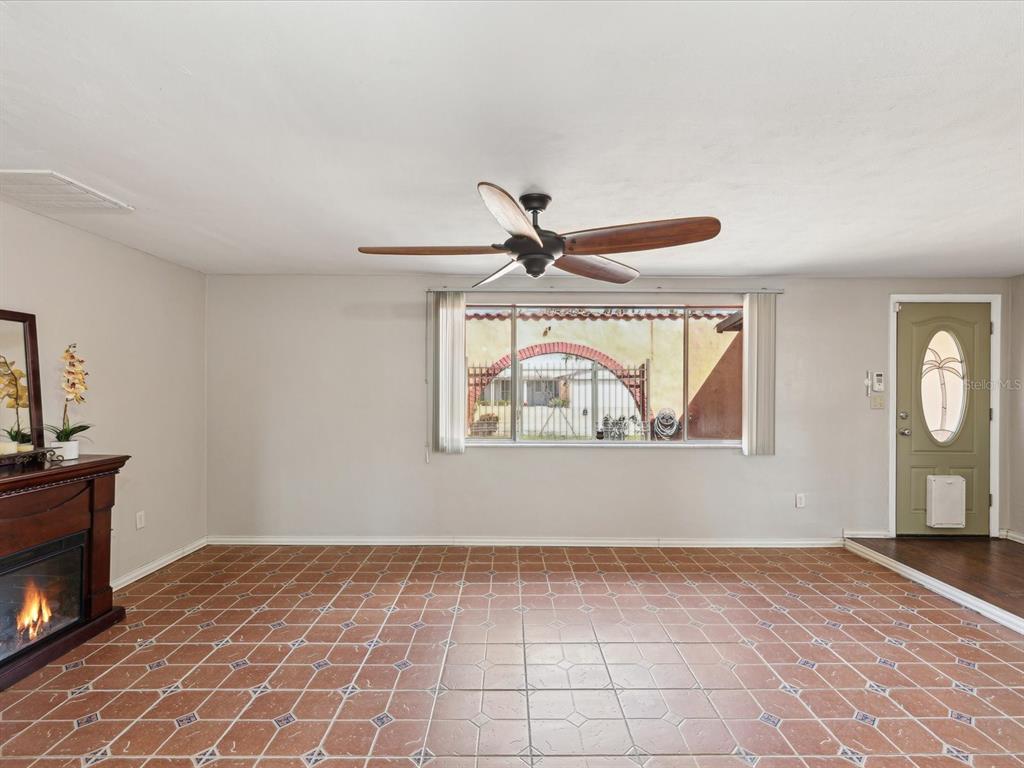 3730 Sail Drive New Port Richey, FL 34652 - Photo 6 of 50 a view of an empty room with window and wooden floor
