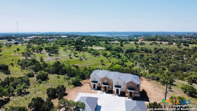 289 Star Grass, Unit 3 Spring Branch, TX 78070 - Photo 36 of 40 an aerial view of a house with a yard