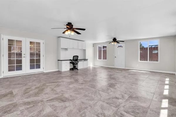 a view of empty room with windows
