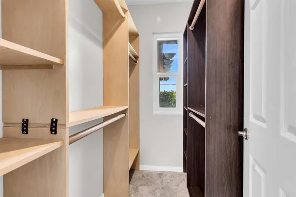 a view of walk in closet with window