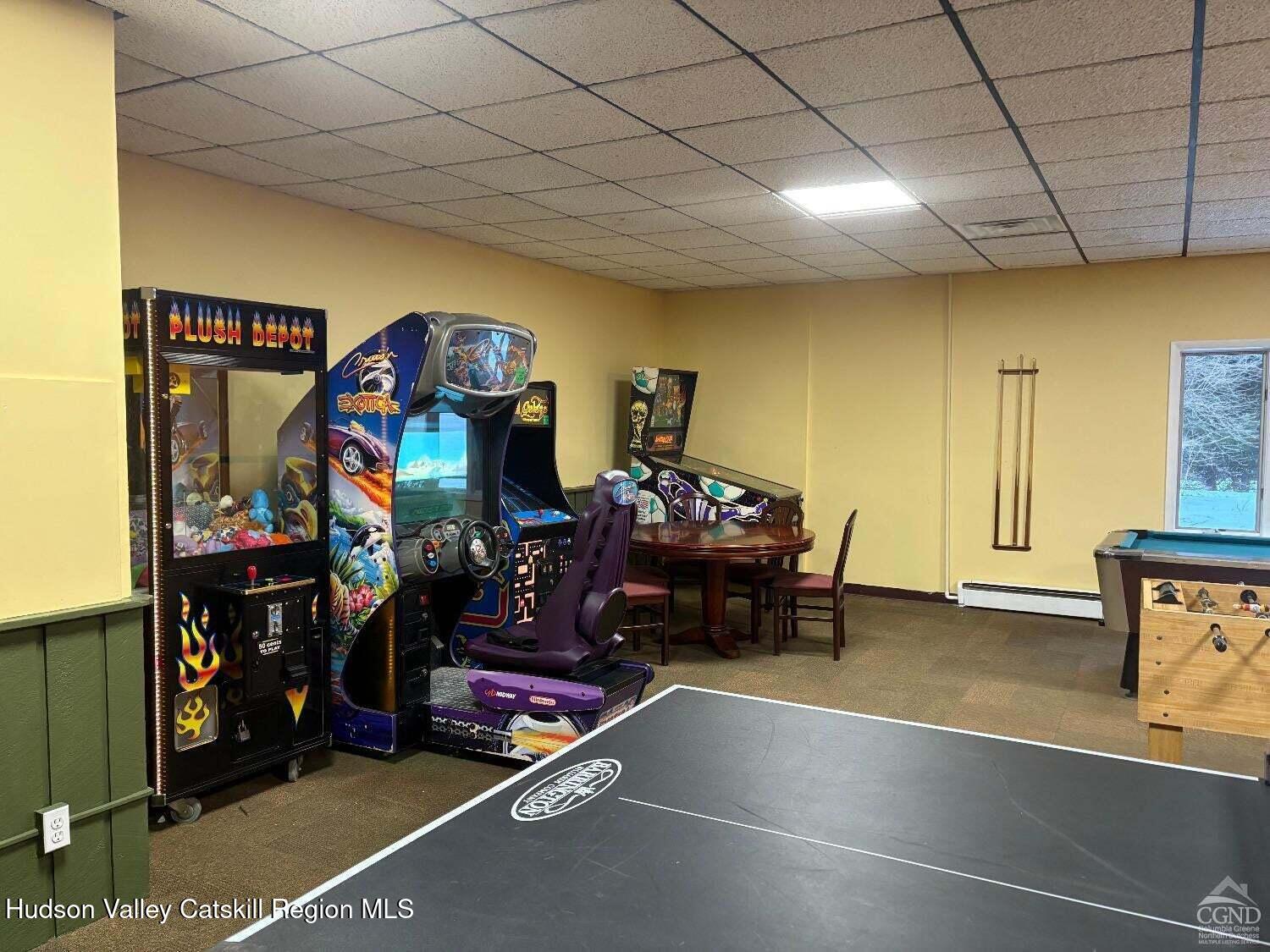 5220 Highway 23, Unit 126 Windham, NY 12496 - Photo 17 of 27 a room with furniture and a flat screen tv