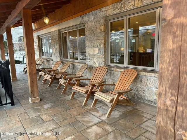 a view of a outdoor space with furniture and windows