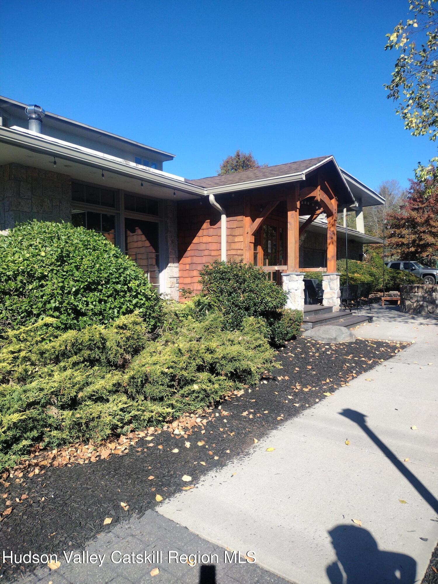 5220 Highway 23, Unit 126 Windham, NY 12496 - Photo 26 of 27 a front view of a house with a yard