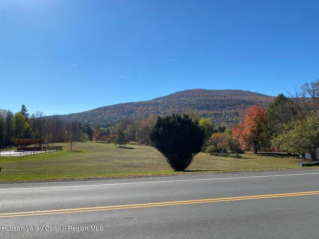 a view of a town with barn house