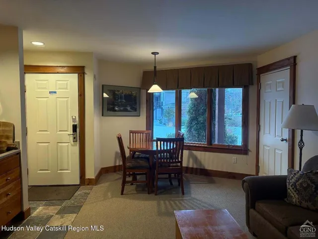 a view of a livingroom with furniture and window