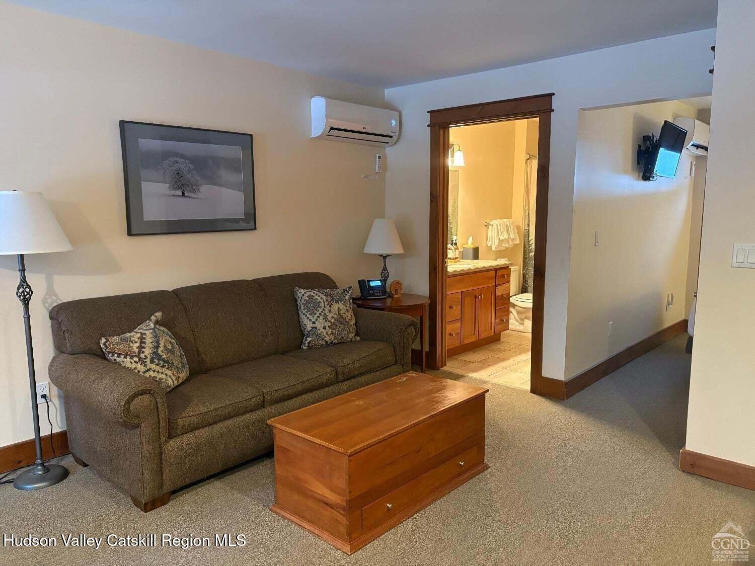 5220 Highway 23, Unit 126 Windham, NY 12496 - Photo 6 of 27 a living room with furniture and a window