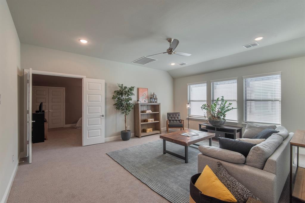 16650 Nightshade Road Frisco, TX 75033 - Photo 31 of 40 a living room with furniture and a wooden floor