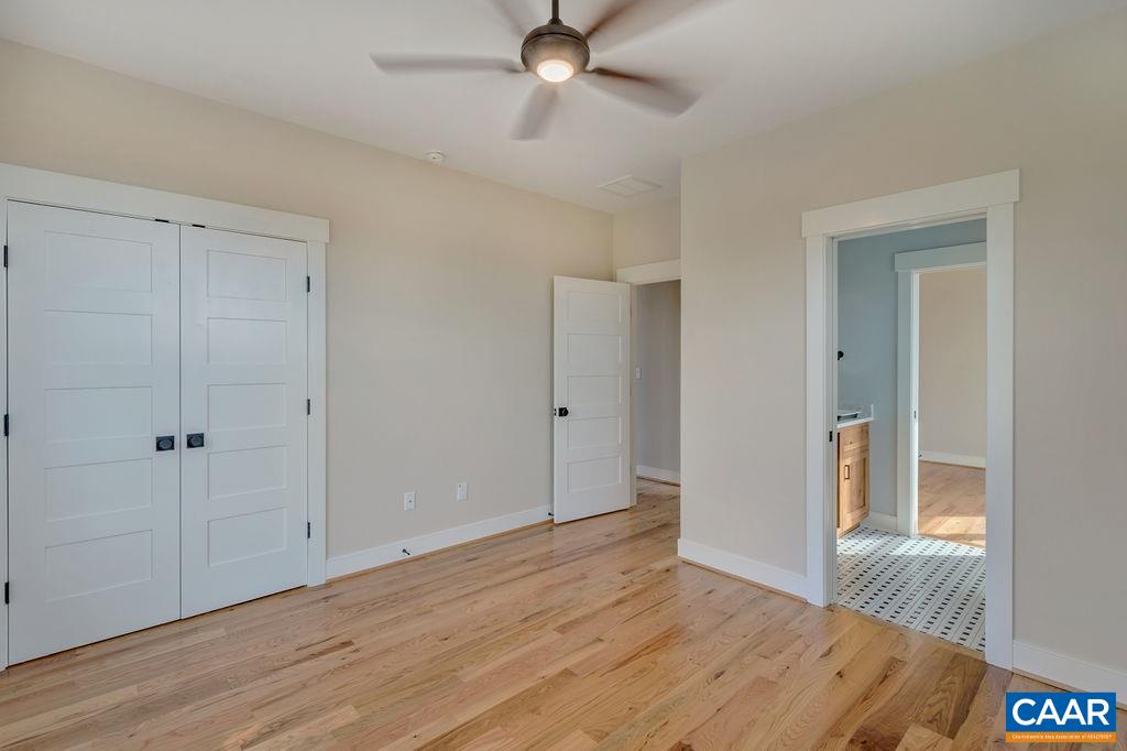 5797 Advance Mills Road Ruckersville, VA 22968 - Photo 19 of 50 wooden floor in an empty room with a window