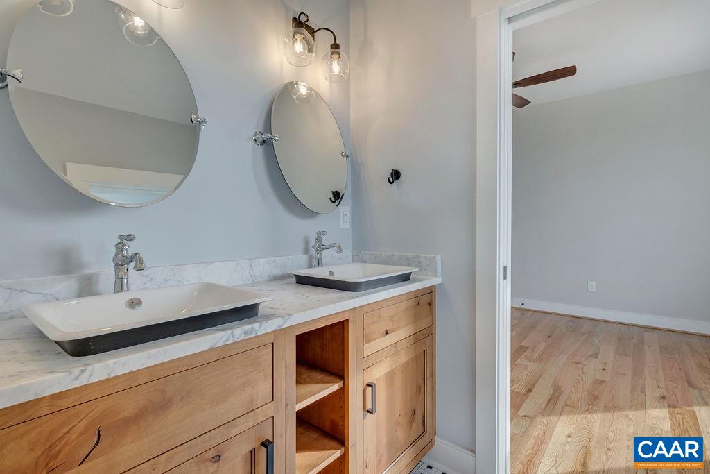 5797 Advance Mills Road Ruckersville, VA 22968 - Photo 21 of 50 a bathroom with a sink and a mirror