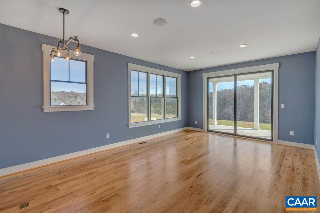 5797 Advance Mills Road Ruckersville, VA 22968 - Photo 24 of 50 a view of an empty room with wooden floor and a window
