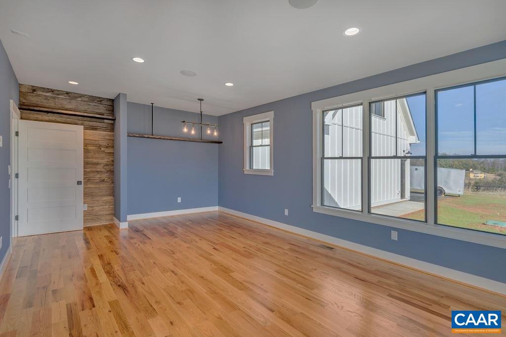 5797 Advance Mills Road Ruckersville, VA 22968 - Photo 25 of 50 wooden floor in an empty room with a window